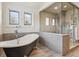 Elegant bathroom with a soaking tub, glass-enclosed shower, and stylish fixtures at 2600 S Adams St, Denver, CO 80210