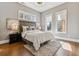 Bright bedroom with hardwood floors, and sun-filled windows at 2600 S Adams St, Denver, CO 80210