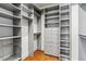 Well-organized walk-in closet with custom shelving, drawers, and hardwood floors at 2600 S Adams St, Denver, CO 80210