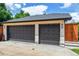 Two-car garage with modern doors, adjacent to the home and set away from the main road at 2600 S Adams St, Denver, CO 80210