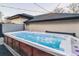 Relaxing hot tub with ambient lighting, set on a wooden deck, perfect for outdoor enjoyment at 2600 S Adams St, Denver, CO 80210