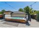 Relaxing outdoor hot tub on a spacious deck with views of the backyard and clear blue sky at 2600 S Adams St, Denver, CO 80210