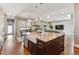 Large kitchen with granite island, modern appliances, and views of the living and dining areas at 2600 S Adams St, Denver, CO 80210