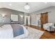 Large main bedroom with hardwood floors, ample natural light, and decorative area rug at 2600 S Adams St, Denver, CO 80210