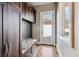 Inviting mudroom features custom built-ins, granite bench, and convenient access to the outdoors at 2600 S Adams St, Denver, CO 80210