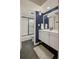 Modern bathroom with updated vanity, stylish mirror, and shower/tub combination with glass enclosure at 2 N Adams St # 108, Denver, CO 80206