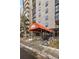 Welcoming entrance of Mountain Shadows Condominiums on Adams St, with landscaped surroundings at 2 N Adams St # 108, Denver, CO 80206