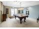 Well-lit game room with a classic billiard table, perfect for entertainment and leisure at 2 N Adams St # 108, Denver, CO 80206