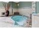 Indoor spa featuring a unique octagonal design, tiled accents, and relaxing ambiance at 2 N Adams St # 108, Denver, CO 80206
