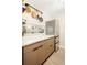 Bright, updated kitchen featuring stainless steel appliances, wood cabinets, and modern finishes at 2 N Adams St # 108, Denver, CO 80206