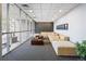 Comfortable and welcoming lobby area with a long couch and glass walls at 2 N Adams St # 108, Denver, CO 80206