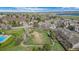 An aerial view of the complex with a dog park, pool, and surrounding trees at 8378 S Upham Way # B305, Littleton, CO 80128