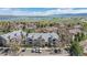 Aerial view of community buildings with scenic lake and mountain views in the background at 8378 S Upham Way # B305, Littleton, CO 80128