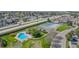 An aerial view of the community showing the pool, tennis courts, and nearby highway access at 8378 S Upham Way # B305, Littleton, CO 80128