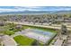 Aerial view of tennis court, basketball court and parking near a highway with mountain views at 8378 S Upham Way # B305, Littleton, CO 80128