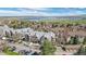 Scenic aerial view of a building in a community with lake and mountain views in the distance at 8378 S Upham Way # B305, Littleton, CO 80128