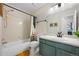 Bathroom featuring a tub, shower, toilet and vanity at 8378 S Upham Way # B305, Littleton, CO 80128
