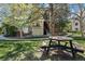 A well-maintained exterior view of a condo building with a beautiful picnic area in a landscaped yard at 8378 S Upham Way # B305, Littleton, CO 80128