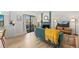 Cozy living room with fireplace, hardwood floors, balcony, and stylish furnishings at 8378 S Upham Way # B305, Littleton, CO 80128