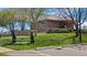 Exterior of 'The Landing' recreation center with lush landscaping and accessible ramp at 8378 S Upham Way # B305, Littleton, CO 80128