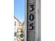 Close-up of unit number 305 on exterior siding at 8378 S Upham Way # B305, Littleton, CO 80128
