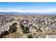 An aerial view of a residential neighborhood with the house indicated by the red arrow at 7858 Oban Ct, Lone Tree, CO 80124