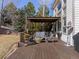 Backyard deck with outdoor seating, fire pit, and pergola, perfect for entertaining at 7858 Oban Ct, Lone Tree, CO 80124