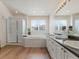 Bright bathroom features a large soaking tub, separate shower, and double vanity sinks, for a spa-like experience at 7858 Oban Ct, Lone Tree, CO 80124