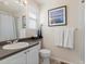 Well-lit bathroom with a modern sink, vanity, and shower, creating a clean and functional space at 7858 Oban Ct, Lone Tree, CO 80124