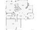 First floor plan featuring a large kitchen, dining room, living room, and a two-car garage at 7858 Oban Ct, Lone Tree, CO 80124