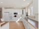 Bright kitchen with white cabinets, modern appliances, and a hardwood floor offers a clean and welcoming atmosphere at 7858 Oban Ct, Lone Tree, CO 80124