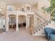 Spacious living room showcasing an open floor plan and staircase with natural light, perfect for entertaining at 7858 Oban Ct, Lone Tree, CO 80124