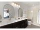 Stylish bathroom featuring dual vanities, modern fixtures, and a walk-in shower at 5351 Warrior St, Frederick, CO 80504