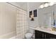 Bright bathroom with a shower-tub combo and modern fixtures at 5351 Warrior St, Frederick, CO 80504