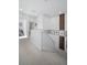Hallway with white walls, and carpet, and an access to a staircase at 5351 Warrior St, Frederick, CO 80504