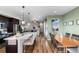 Beautiful kitchen with stainless appliances, view into a living and dining space at 5351 Warrior St, Frederick, CO 80504