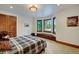 A comfortable bedroom has built in seating and large windows at 219 Glen Eagle Loop, Breckenridge, CO 80424