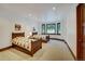 Bright bedroom featuring two twin beds, neutral carpet, and a window overlooking a snowy outdoor setting at 219 Glen Eagle Loop, Breckenridge, CO 80424