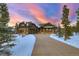 Stunning front exterior of a multi-story home with an attached garage and a long driveway at 219 Glen Eagle Loop, Breckenridge, CO 80424