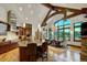 A modern gourmet kitchen with an island, breakfast nook, wood floors, and high ceilings at 219 Glen Eagle Loop, Breckenridge, CO 80424