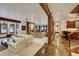 Spacious open-concept living room with exposed beams, stone fireplace and bar area at 219 Glen Eagle Loop, Breckenridge, CO 80424