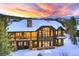 A beautiful mountain home showing off a large stone fireplace and plenty of windows at 219 Glen Eagle Loop, Breckenridge, CO 80424