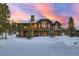 Expansive rear exterior with multiple balconies and large windows overlooking the snowy landscape at 219 Glen Eagle Loop, Breckenridge, CO 80424