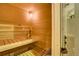Wooden sauna with benches, heater, and traditional accessories, promising relaxation and wellness at 219 Glen Eagle Loop, Breckenridge, CO 80424
