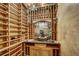Custom wine cellar with ample storage and artistic backdrop for wine appreciation at 219 Glen Eagle Loop, Breckenridge, CO 80424