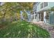 Lush backyard with mature trees and a well-maintained lawn, perfect for outdoor enjoyment at 6317 Ruby Hill Dr, Erie, CO 80516