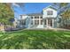 Spacious backyard with a concrete patio, ideal for relaxing and entertaining at 6317 Ruby Hill Dr, Erie, CO 80516