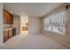 Finished basement with a window view and convenient wet bar area at 6317 Ruby Hill Dr, Erie, CO 80516