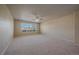Large bedroom with a ceiling fan, carpet and neutral colored walls at 6317 Ruby Hill Dr, Erie, CO 80516