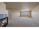 Large bedroom with carpet flooring and a fireplace at 6317 Ruby Hill Dr, Erie, CO 80516